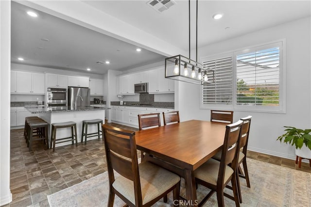2694 Kings Canyon Dr, Jurupa Valley, CA 92509 - dining space with stone finish floors and recessed lighting