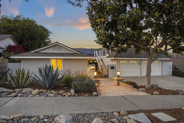4071 Doane St, Ventura, CA 93003 - view of front of property with solar panels, concrete driveway, roof with shingles, and a garage