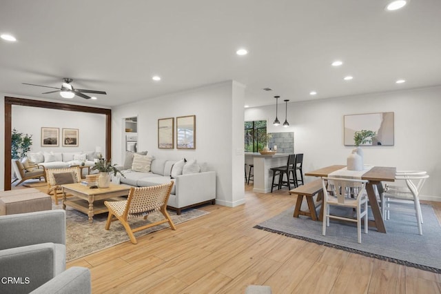 4071 Doane St, Ventura, CA 93003 - living room with light wood-style flooring, recessed lighting, ornamental molding, and a ceiling fan