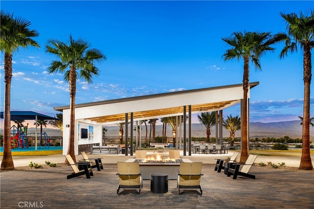 36342 Warren Dr, Palm Desert, CA 92211 - surrounding community with an outdoor fire pit and a mountain view