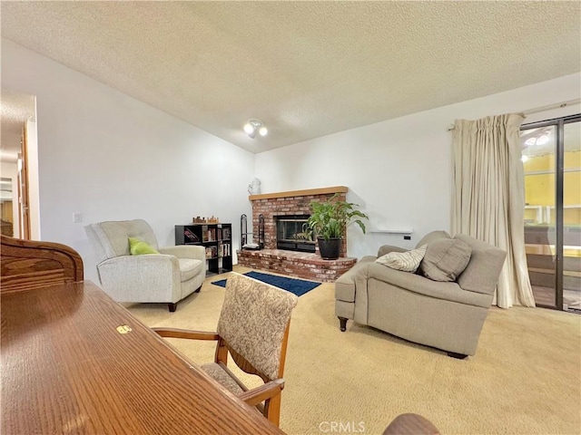6774 Galleta Ave Unit 29, Palms, CA 92277 - carpeted living room featuring a textured ceiling, vaulted ceiling, and a brick fireplace