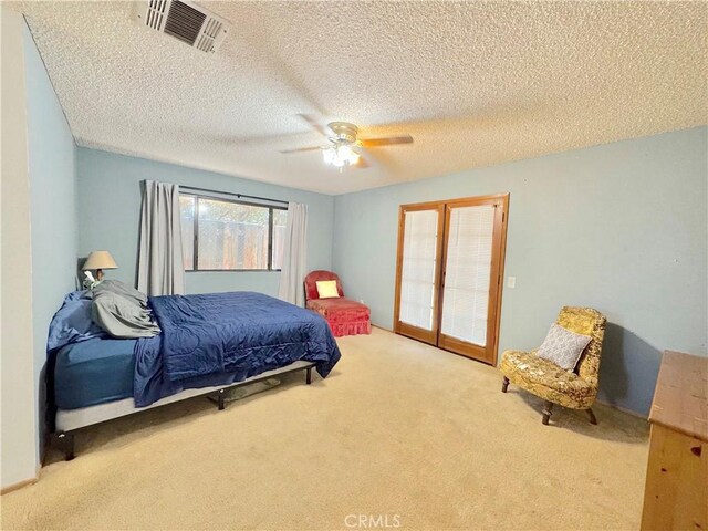 6774 Galleta Ave Unit 29, Palms, CA 92277 - bedroom with carpet, ceiling fan, and a textured ceiling