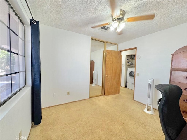 6774 Galleta Ave Unit 29, Palms, CA 92277 - home office featuring light colored carpet, ceiling fan, washer / dryer, and a textured ceiling