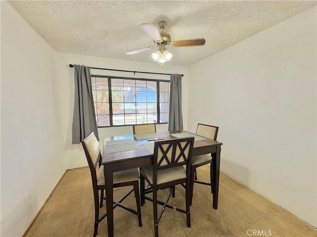 6774 Galleta Ave Unit 29, Palms, CA 92277 - dining space featuring light carpet, a textured ceiling, and ceiling fan