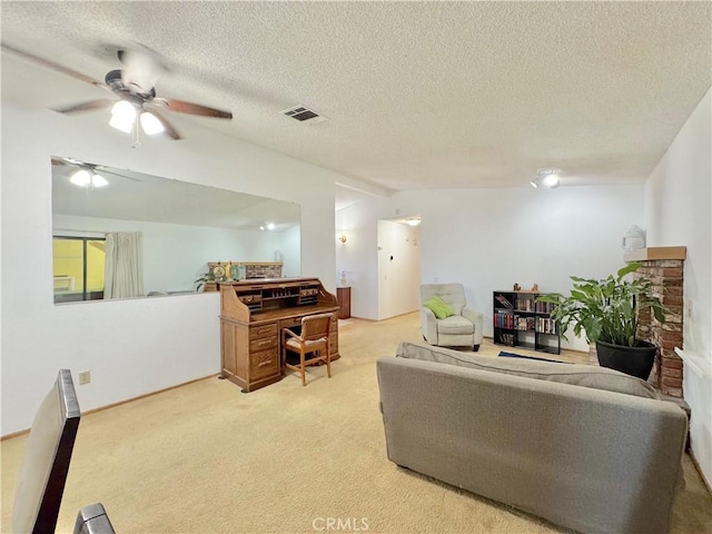 6774 Galleta Ave Unit 29, Palms, CA 92277 - living area featuring light carpet, vaulted ceiling, ceiling fan, and a textured ceiling