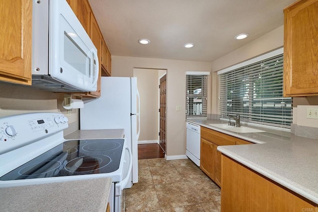 932 Alyssum Rd, Carlsbad, CA 92011 - kitchen with white appliances, recessed lighting, light countertops, and brown cabinetry