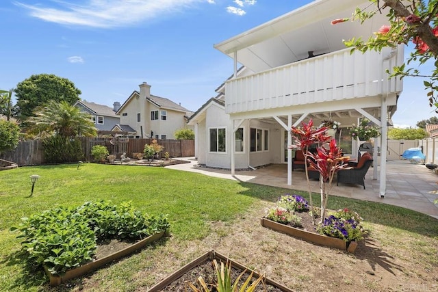 647 Boysenberry Way, Oceanside, CA 92057 - fenced backyard featuring a garden and a patio area