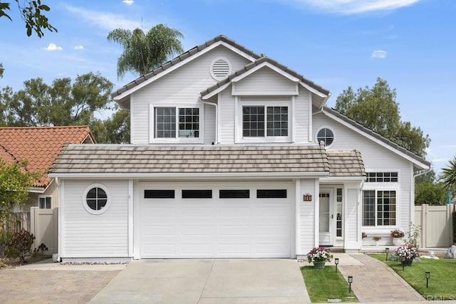 647 Boysenberry Way, Oceanside, CA 92057 - traditional home featuring a garage, driveway, and a tile roof