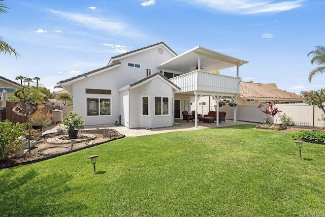 647 Boysenberry Way, Oceanside, CA 92057 - rear view of house featuring a balcony, a fenced backyard, a patio area, a ceiling fan, and stucco siding