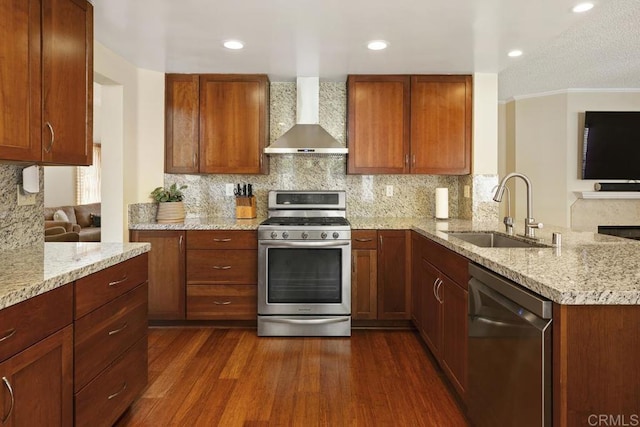 647 Boysenberry Way, Oceanside, CA 92057 - kitchen featuring appliances with stainless steel finishes, wall chimney range hood, a peninsula, backsplash, and light stone countertops