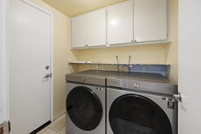 647 Boysenberry Way, Oceanside, CA 92057 - laundry room featuring washing machine and clothes dryer, cabinet space, and light tile patterned floors