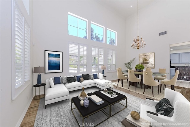 2768 Somerset Pl, Rowland Heights, CA 91748 - living area with wood finished floors, a towering ceiling, and a chandelier