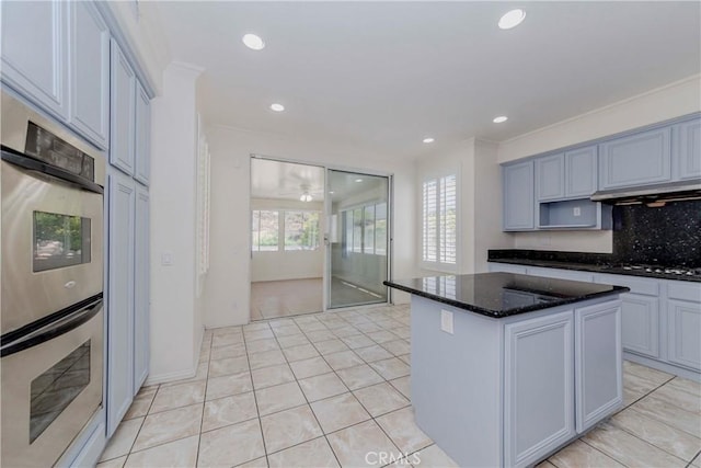 2768 Somerset Pl, Rowland Heights, CA 91748 - kitchen with double oven, under cabinet range hood, recessed lighting, a center island, and dark stone countertops