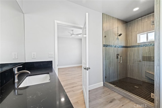 11128 Stamy Rd, Whittier, CA 90604 - bathroom featuring a shower stall, wood finished floors, double vanity, recessed lighting, and a ceiling fan