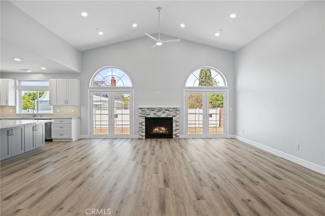 11128 Stamy Rd, Whittier, CA 90604 - unfurnished living room with high vaulted ceiling, a ceiling fan, light wood-style flooring, french doors, and recessed lighting