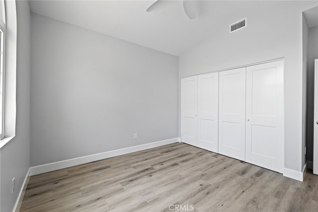 11128 Stamy Rd, Whittier, CA 90604 - unfurnished bedroom with light wood finished floors, vaulted ceiling, a closet, and ceiling fan
