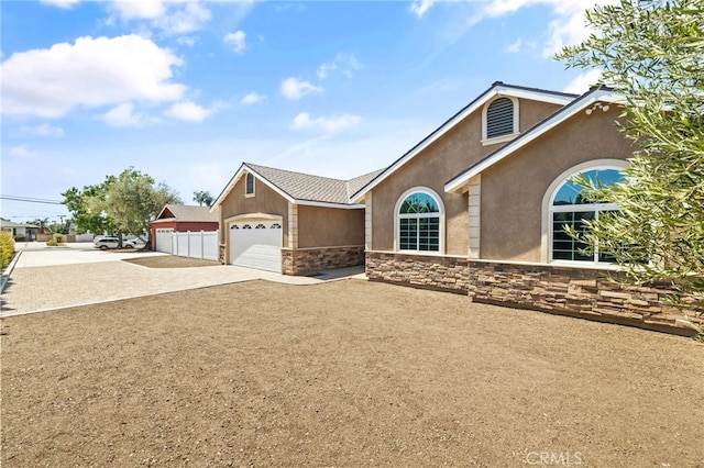 11128 Stamy Rd, Whittier, CA 90604 - single story home featuring driveway, stucco siding, and stone siding