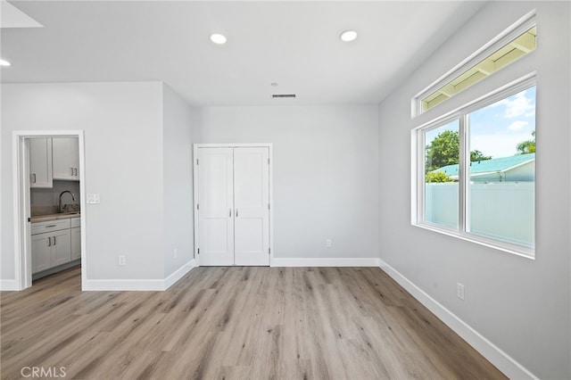 11128 Stamy Rd, Whittier, CA 90604 - unfurnished bedroom featuring light wood-type flooring, recessed lighting, a closet, and connected bathroom