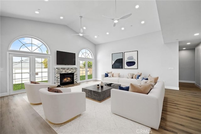 11128 Stamy Rd, Whittier, CA 90604 - living room featuring wood finished floors, ceiling fan, high vaulted ceiling, a tiled fireplace, and recessed lighting