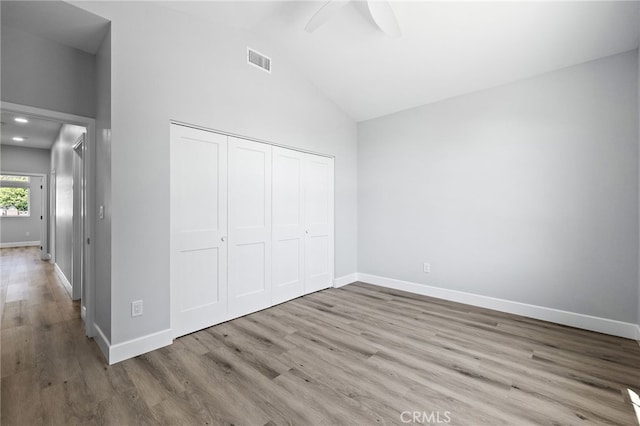 11128 Stamy Rd, Whittier, CA 90604 - unfurnished bedroom with wood finished floors, a closet, ceiling fan, and high vaulted ceiling