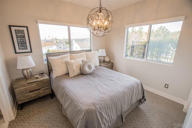 7570 Gibraltar St Unit 101, Carlsbad, CA 92009 - bedroom with light carpet and a chandelier