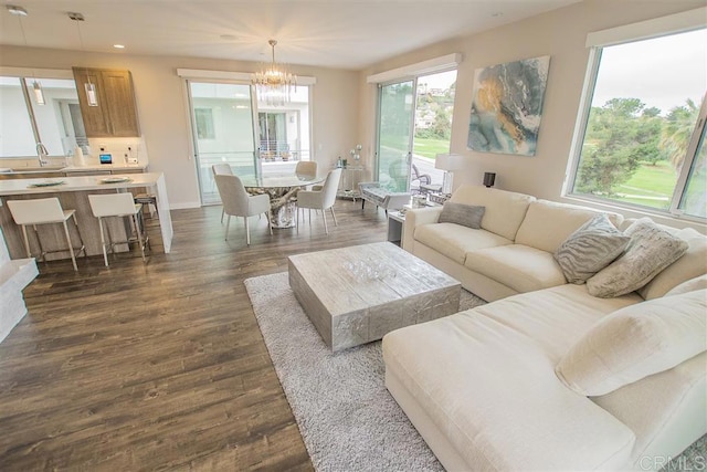 7570 Gibraltar St Unit 101, Carlsbad, CA 92009 - living room featuring recessed lighting, dark wood-style flooring, and a chandelier