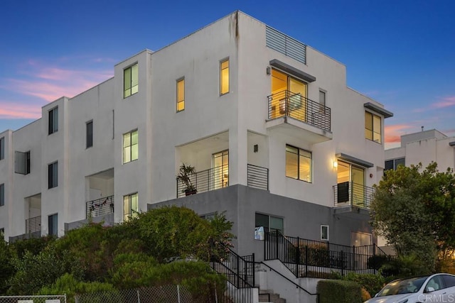7570 Gibraltar St Unit 101, Carlsbad, CA 92009 - view of property at dusk