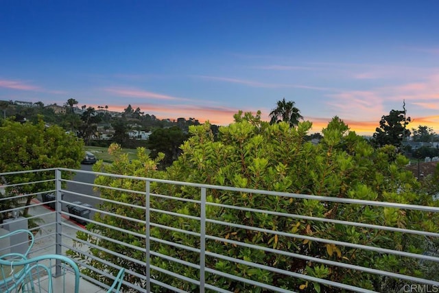 7570 Gibraltar St Unit 101, Carlsbad, CA 92009 - view of balcony at dusk