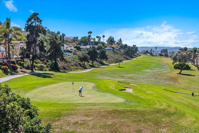 7570 Gibraltar St Unit 101, Carlsbad, CA 92009 - view of community with view of golf course and a mountain view
