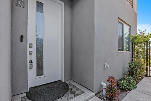 7570 Gibraltar St Unit 101, Carlsbad, CA 92009 - property entrance featuring stucco siding