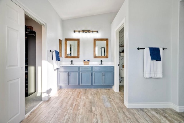 5232 Palmera Dr, Oceanside, CA 92056 - bathroom with wood finished floors and double vanity