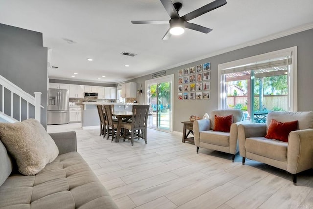 5232 Palmera Dr, Oceanside, CA 92056 - living area featuring crown molding, stairs, a ceiling fan, recessed lighting, and light wood-style flooring