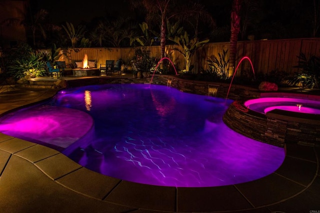 5232 Palmera Dr, Oceanside, CA 92056 - pool at twilight featuring an outdoor fire pit, a pool with connected hot tub, a patio area, and a fenced backyard