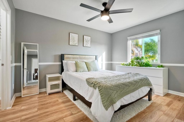5232 Palmera Dr, Oceanside, CA 92056 - bedroom with light wood finished floors and ceiling fan