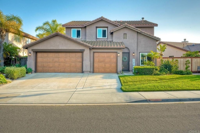 5232 Palmera Dr, Oceanside, CA 92056 - view of front of house with stucco siding, driveway, a tiled roof, and an attached garage