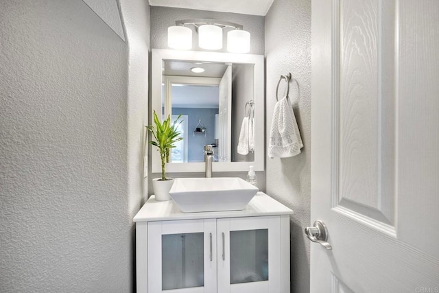 5232 Palmera Dr, Oceanside, CA 92056 - bathroom with a textured wall and vanity