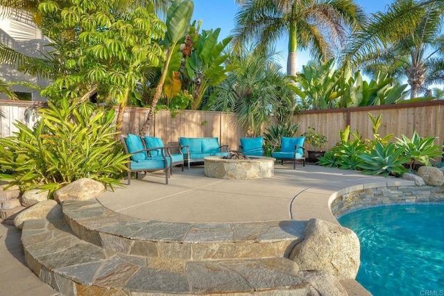 5232 Palmera Dr, Oceanside, CA 92056 - view of swimming pool featuring a patio area, an outdoor fire pit, and a fenced backyard