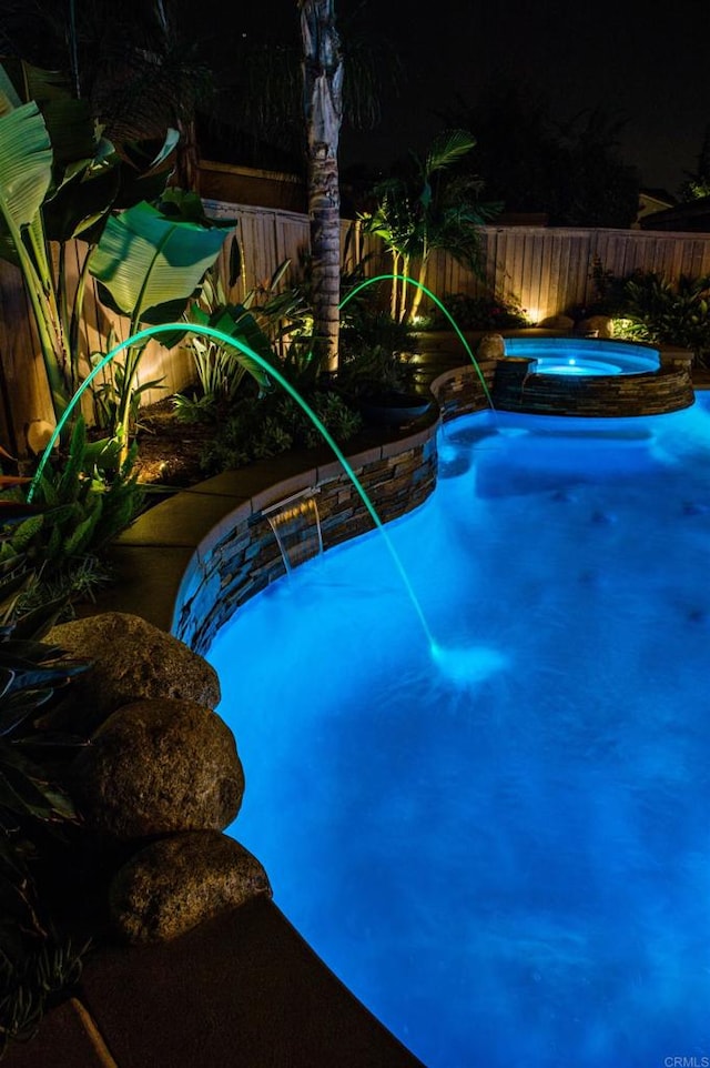 5232 Palmera Dr, Oceanside, CA 92056 - pool at twilight with an in-ground hot tub