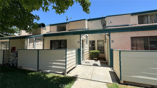44460 15th St E Unit 13, Lancaster, CA 93535 - back of house featuring stucco siding