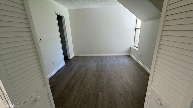 44460 15th St E Unit 13, Lancaster, CA 93535 - bonus room featuring a textured ceiling and dark wood-style floors