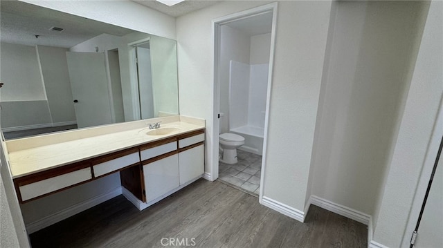 44460 15th St E Unit 13, Lancaster, CA 93535 - bathroom with wood finished floors, vanity, and tub / shower combination