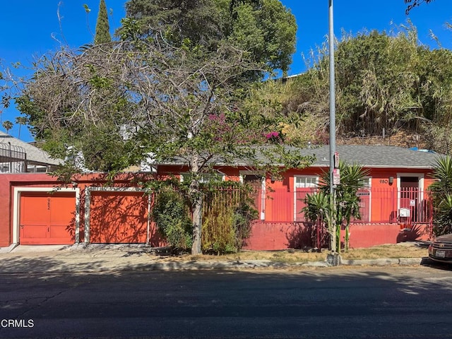980 N Hoover St, Los Angeles, CA 90029 - obstructed view of property featuring an attached garage