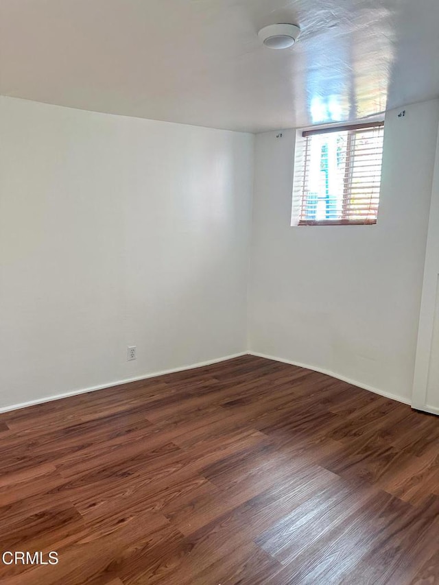 980 N Hoover St, Los Angeles, CA 90029 - empty room featuring wood finished floors and baseboards