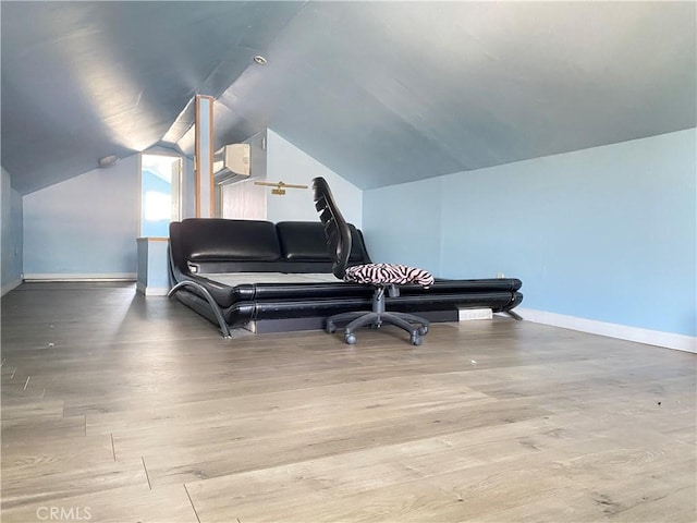 3759 Ahern Dr, Baldwin Park, CA 91706 - living area with wood finished floors, lofted ceiling, and an AC wall unit