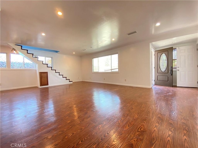 3759 Ahern Dr, Baldwin Park, CA 91706 - unfurnished living room with dark wood finished floors, stairway, and recessed lighting