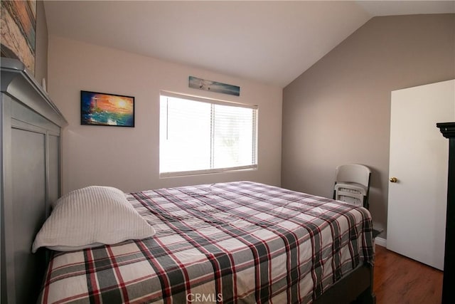 13421 Hubbard St Unit 119, Sylmar, CA 91342 - bedroom with wood finished floors and vaulted ceiling