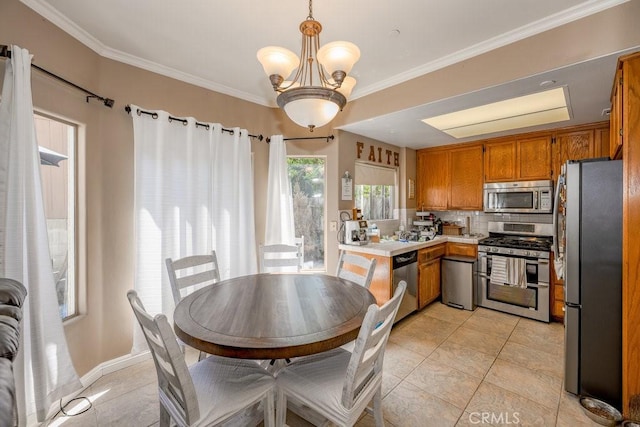 13421 Hubbard St Unit 119, Sylmar, CA 91342 - kitchen with stainless steel appliances, light countertops, brown cabinets, light tile patterned floors, and a chandelier