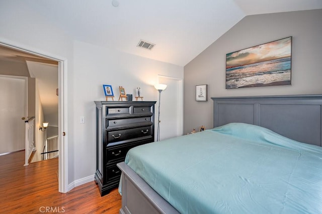 13421 Hubbard St Unit 119, Sylmar, CA 91342 - bedroom featuring lofted ceiling and wood finished floors
