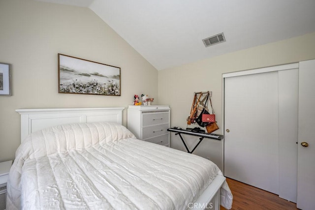 13421 Hubbard St Unit 119, Sylmar, CA 91342 - bedroom with lofted ceiling, wood finished floors, and a closet