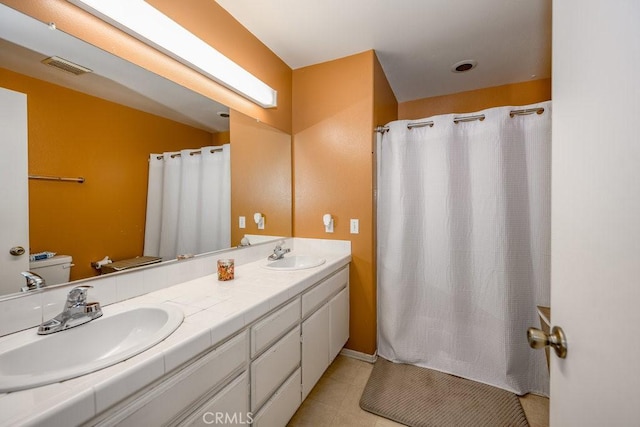 13421 Hubbard St Unit 119, Sylmar, CA 91342 - bathroom featuring double vanity, tile patterned flooring, and a shower with curtain